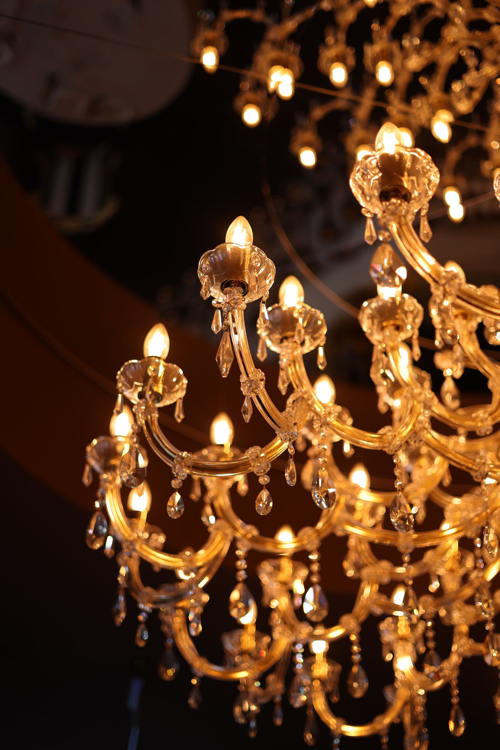 Close view of illuminated crystal chandelier details