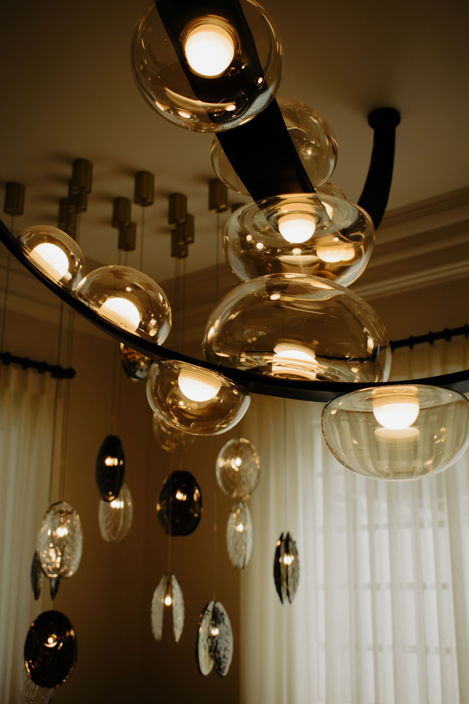 Contemporary sculptural chandelier with glass elements