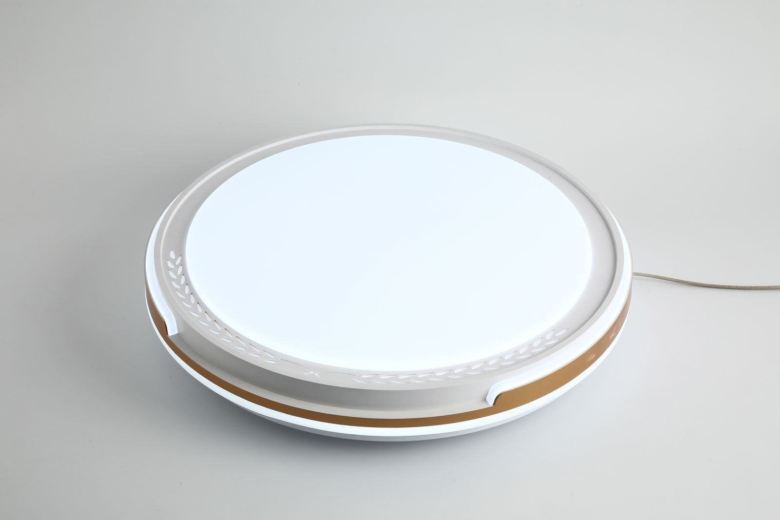 Contemporary LED ceiling fixture on a neutral surface