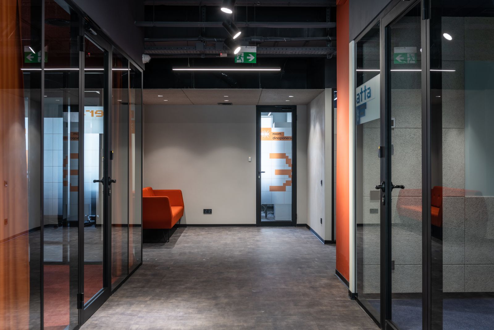 Modern commercial corridor with coordinated overhead lighting