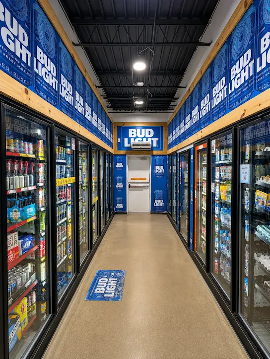 Branded retail aisle with printed graphics and floor decals