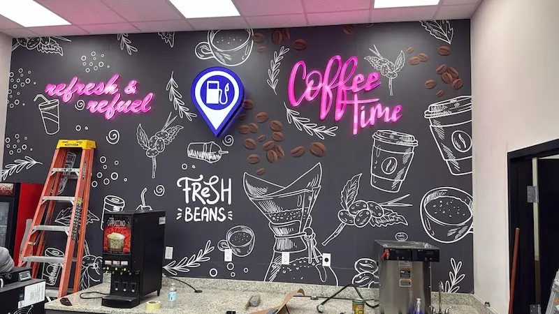 Neon style LED signs on a branded cafe wall