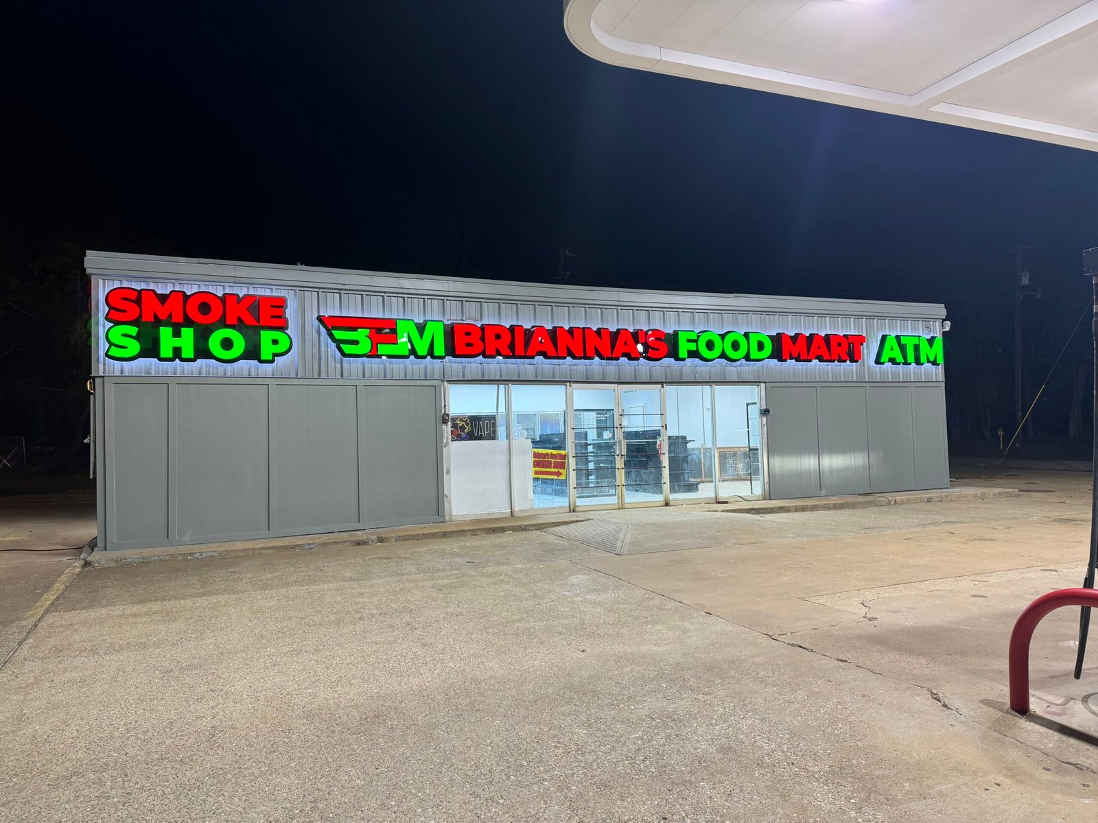 Storefront with illuminated LED signs at night