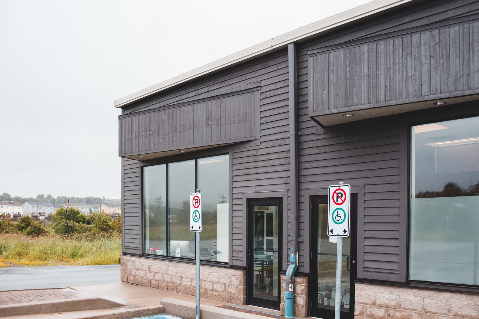Modern street-facing commercial building prepared for business identification