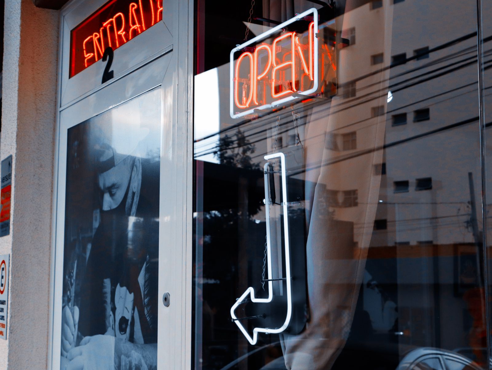 Storefront with illuminated signage reviewed for a new identification scheme